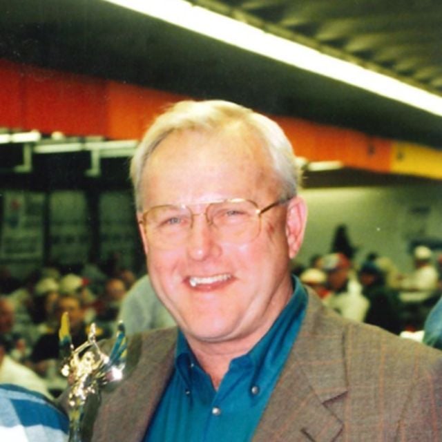 Humpy Wheeler stands in Charlotte Motor Speedway's garage during a Legend Car banquet celebration.
