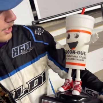 Ben Morabito, the Pro division Champ, shows off his title belt and Milkshake Trophy at Cookout Summer Shootout at Charlo...